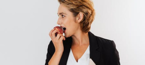 FEGLI Option A ; image: woman biting apple