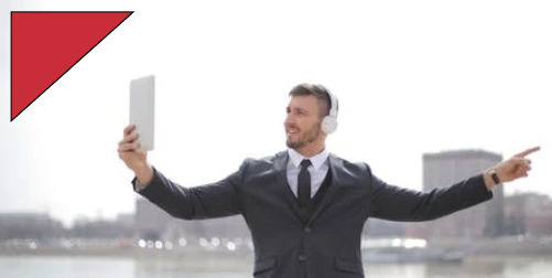 Executive Coach ' Image: man in suit pointing while holding tablet