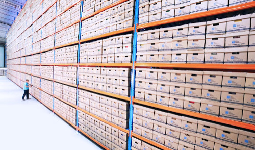 OPM Retirement Services ; image: warehouse filled with archive boxes