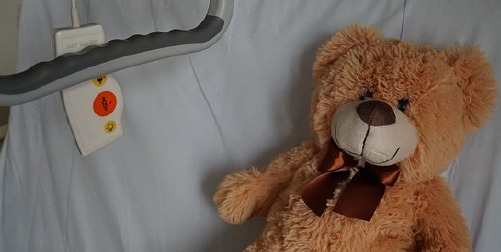 when to purchase long-term care insurance ; image: teddy bear on hospital bed