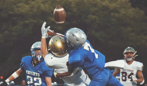 Federal Retirement Lessons from Football ; image: saftey defending pass during football game