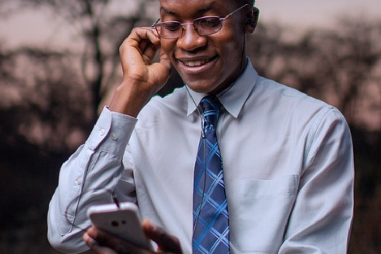 Fed15 Podcast ; image: middle aged man smiling, listening to podcast