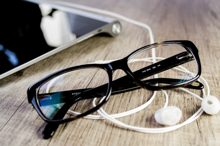 Survivor Benefits podcast ; image: glasses and headphones