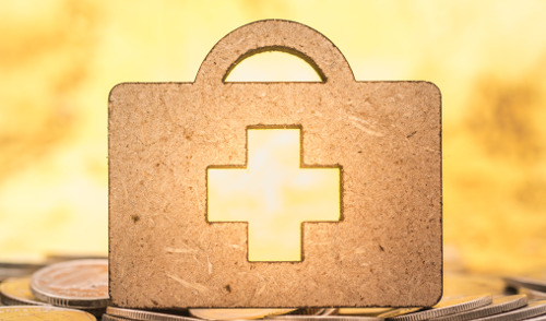 2024 HSA Contribution Limit for Federal Employees ; image: gold first aid kit on coins