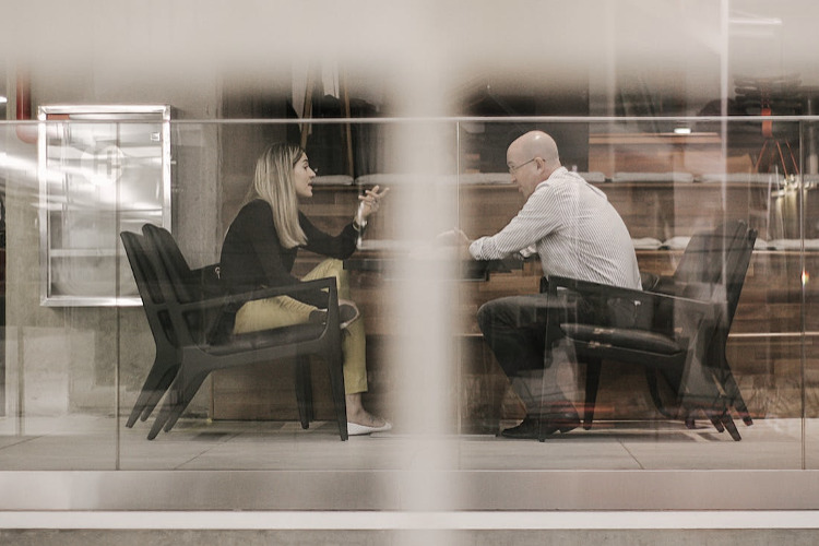 What is a Viatical Settlement - image: man and woman talking at a table