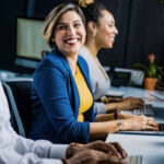 Quiz for Federal Employees ; image: three happy workers at computers