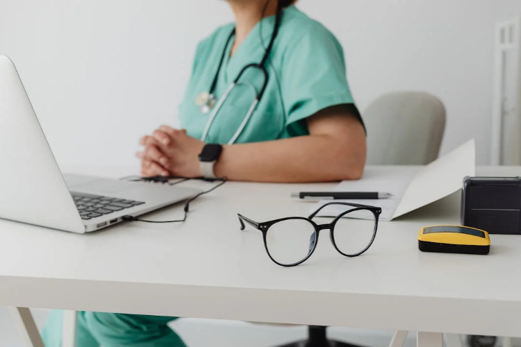 FEHB Open Season ; image: doctor's desk with glasses