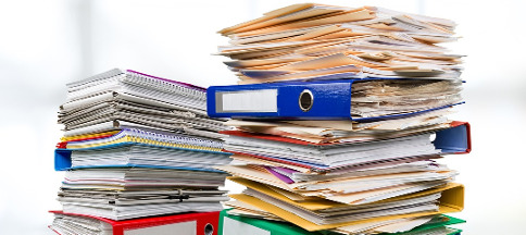 Inspector General at OPM Retirement Services ; image: pile of paper documents