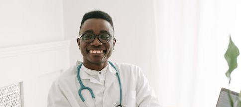 eligibility for federal employee health benefits - image: smiling young doctor