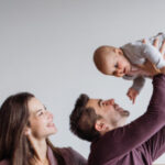 FEGLI Qualifying Life Events ; image: young family with baby