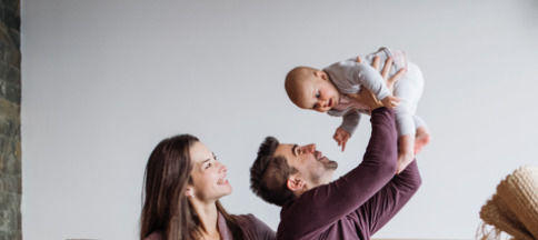 FEGLI Qualifying Life Events ; image: young family with baby